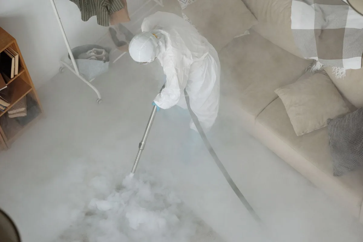 Biohazard cleanup technician in protective equipment, Salamatof, AK